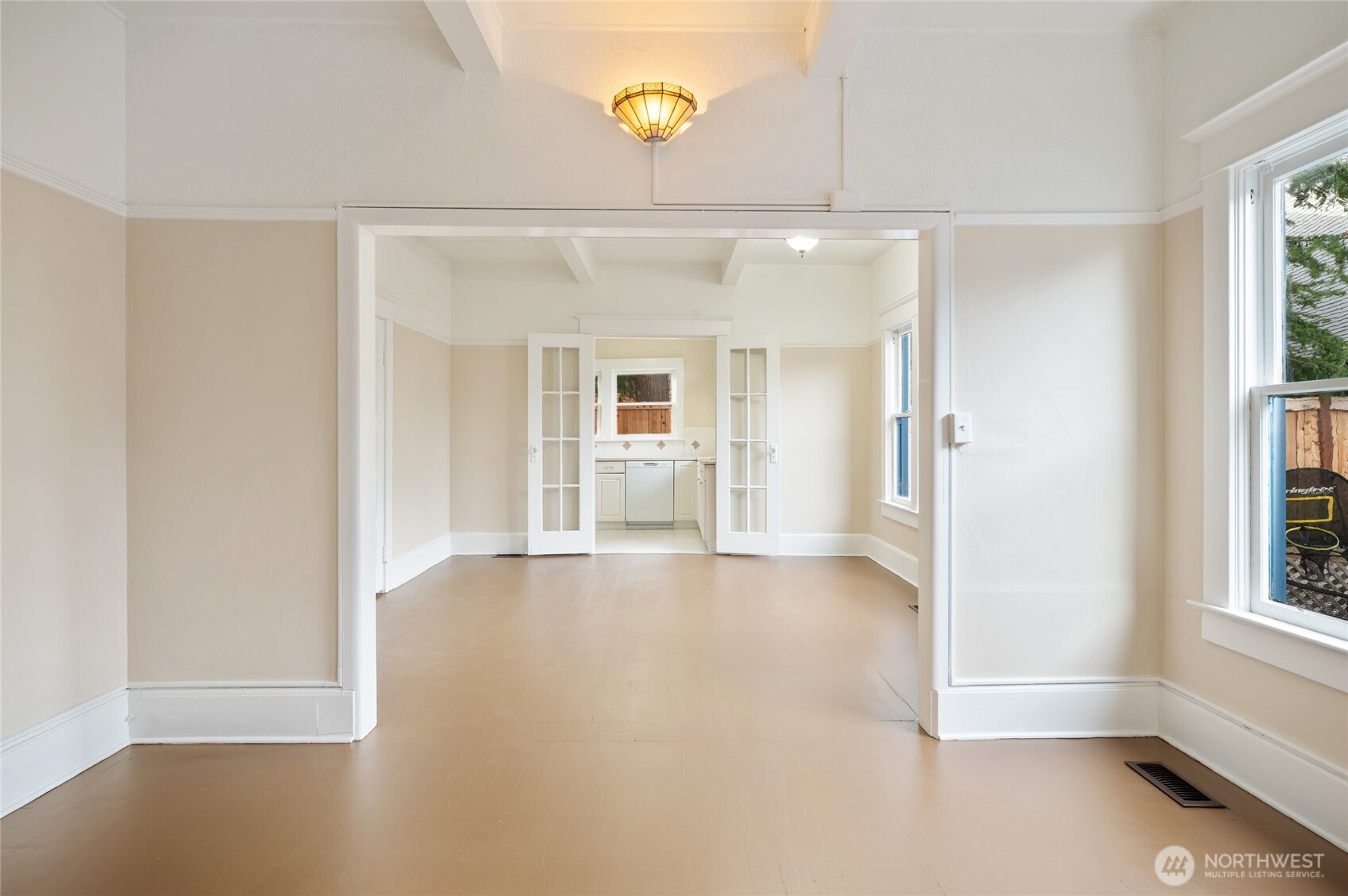 1425 Palm Avenue Southwest Seattle, WA 98116 - Photo 14 of 23 a view of a big room with windows and cabinet
