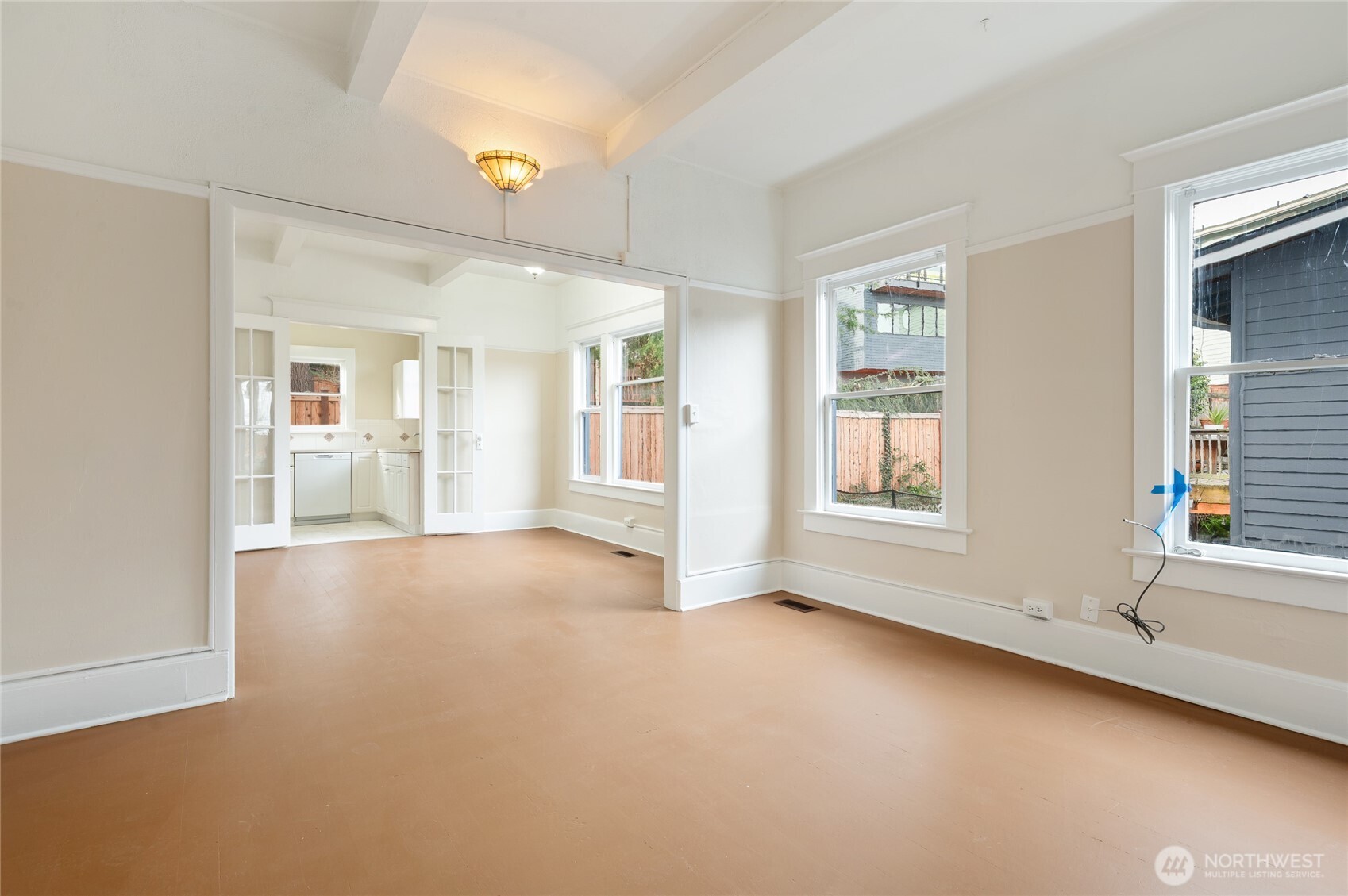 1425 Palm Avenue Southwest Seattle, WA 98116 - Photo 15 of 23 an empty room with windows and entrance