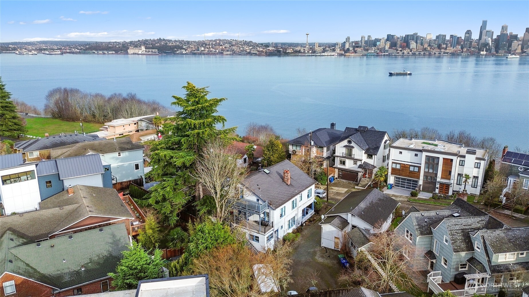 1425 Palm Avenue Southwest Seattle, WA 98116 - Photo 2 of 23 an aerial view of a house with a lake view