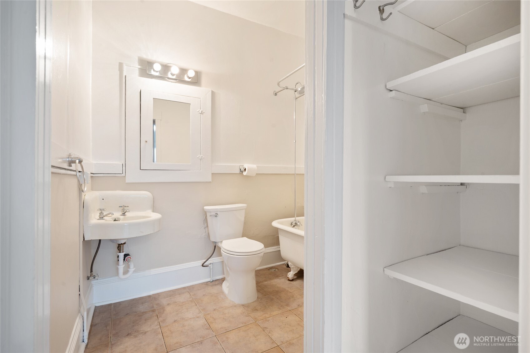 1425 Palm Avenue Southwest Seattle, WA 98116 - Photo 23 of 23 a bathroom with a toilet a sink and a mirror