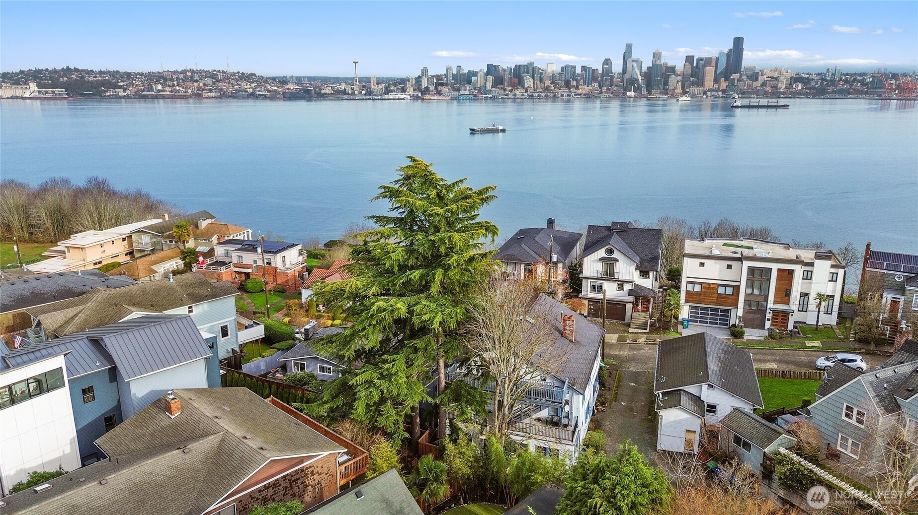 1425 Palm Avenue Southwest Seattle, WA 98116 - Photo 8 of 23 an aerial view of a city with lake view