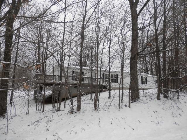 18402 Litzen Road Copemish, MI 49625 - Photo 1 of 34 Front View/Walk Out Basement