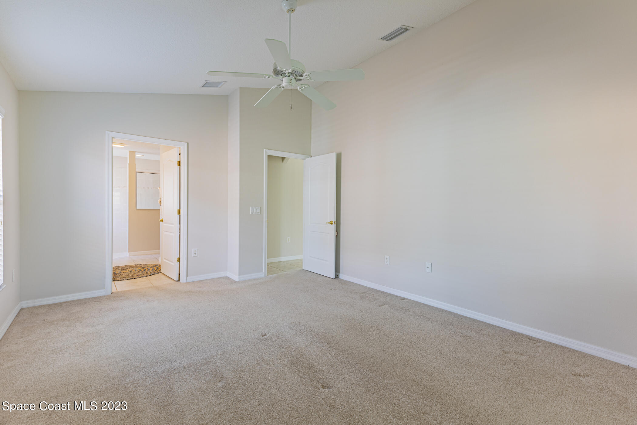 3102 Galindo Circle Melbourne, FL 32940 - Photo 19 of 31 an empty room with chandelier fan
