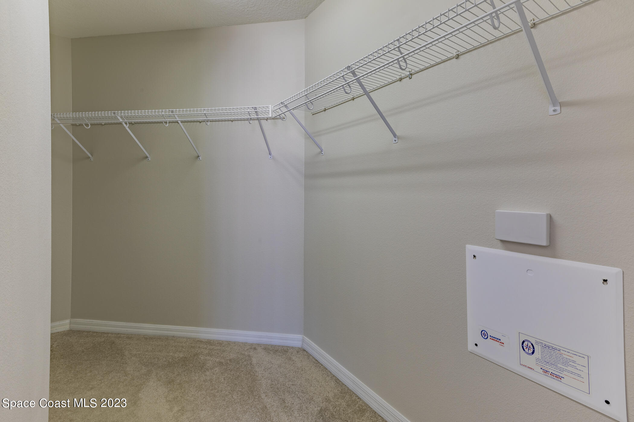 3102 Galindo Circle Melbourne, FL 32940 - Photo 20 of 31 a view of storage and utility room with racks on the wall