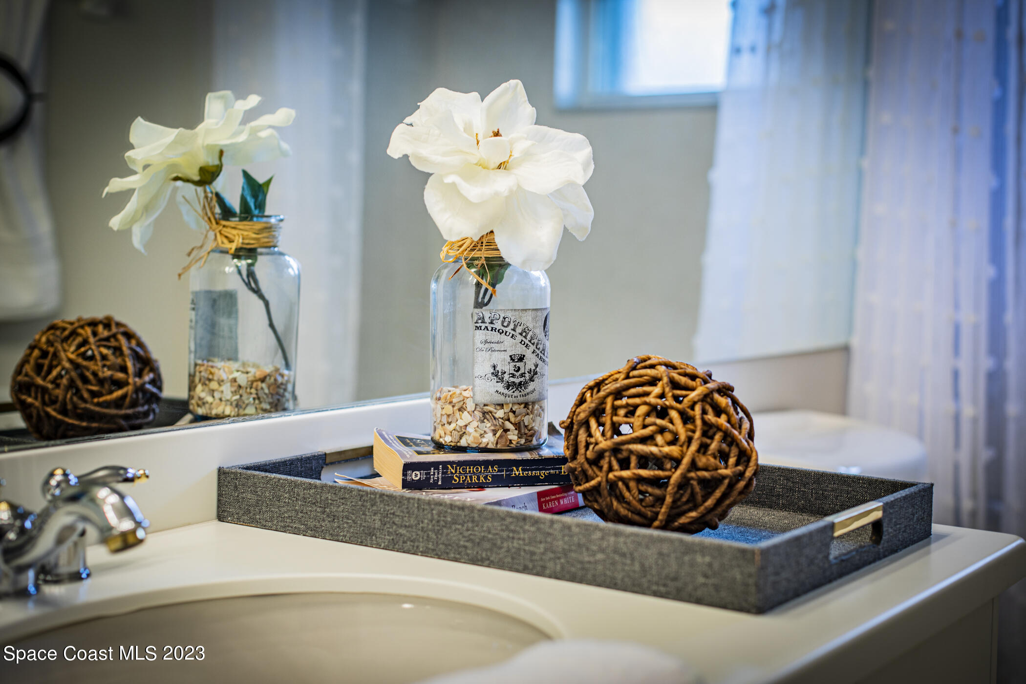3102 Galindo Circle Melbourne, FL 32940 - Photo 30 of 31 a room with a table flowerpot and a chandelier