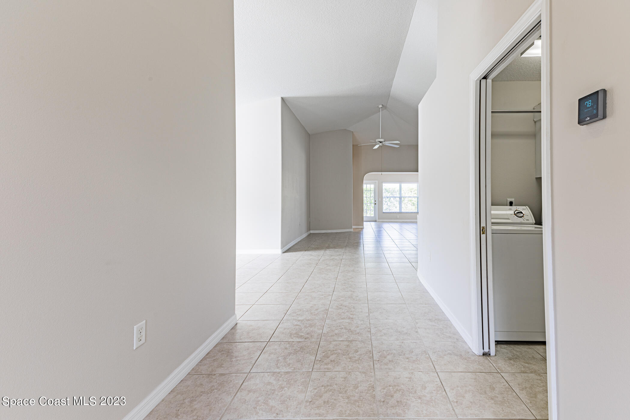 3102 Galindo Circle Melbourne, FL 32940 - Photo 3 of 31 a view of a hallway with wooden floor and staircase