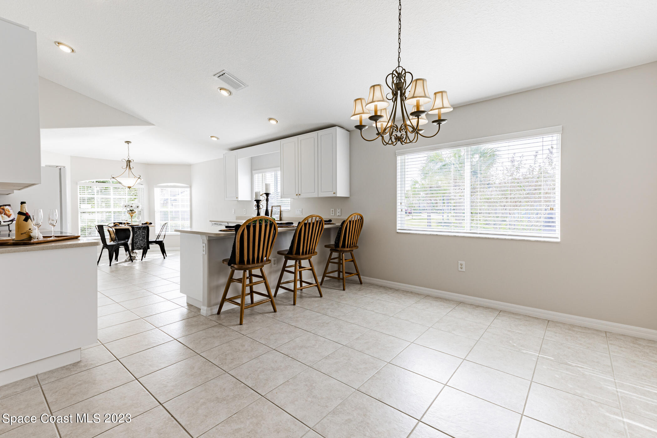 3102 Galindo Circle Melbourne, FL 32940 - Photo 4 of 31 a view of a dining room with furniture window and outside view