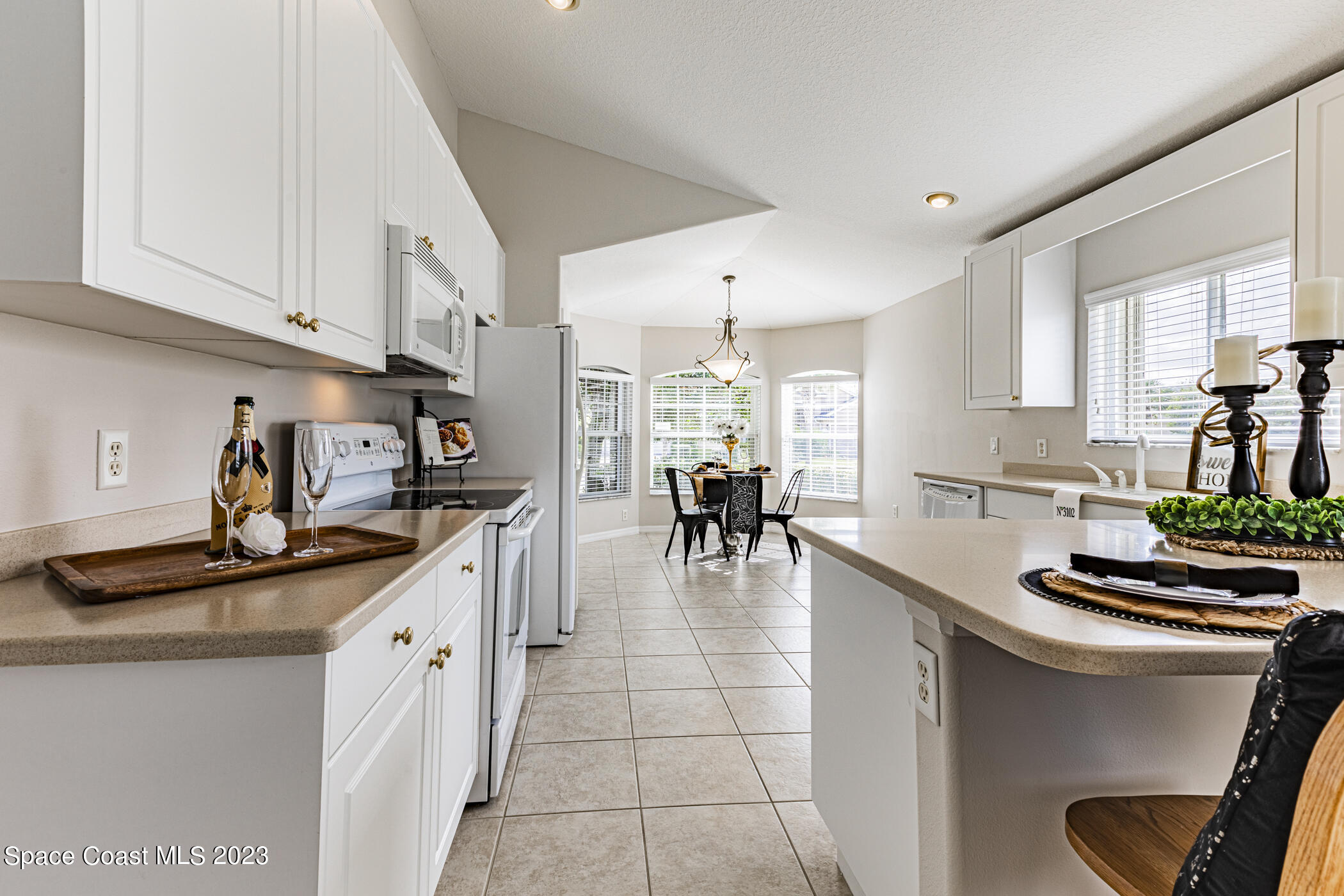 3102 Galindo Circle Melbourne, FL 32940 - Photo 5 of 31 a kitchen with stainless steel appliances granite countertop a sink and cabinets