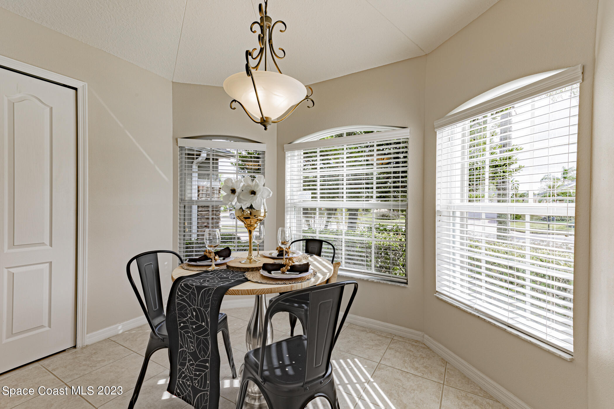 3102 Galindo Circle Melbourne, FL 32940 - Photo 6 of 31 a view of a dining room with furniture window and outside view
