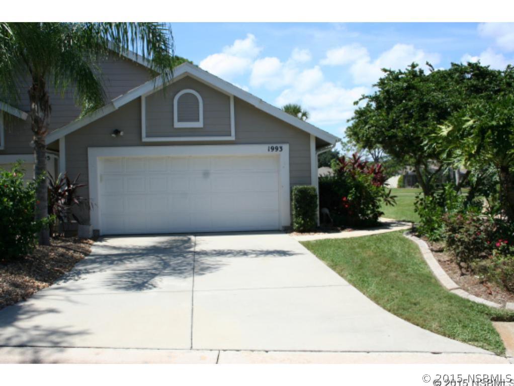 1993 Rutgers Place, Unit 43 Port Orange, FL 32128 - Photo 2 of 24 a front view of a house with garden