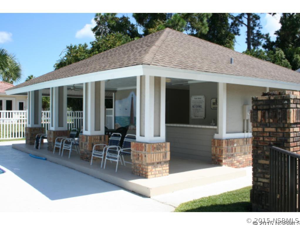 1993 Rutgers Place, Unit 43 Port Orange, FL 32128 - Photo 23 of 24 a view of a house with patio