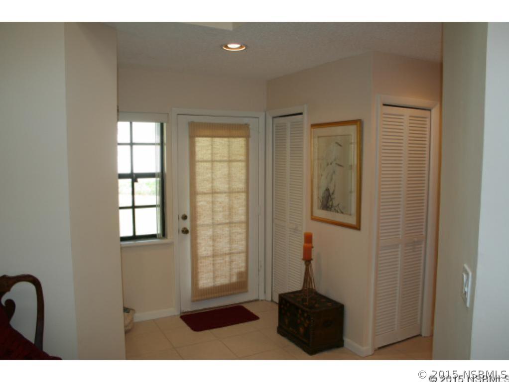 1993 Rutgers Place, Unit 43 Port Orange, FL 32128 - Photo 6 of 24 a living room with furniture and a window