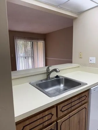 a view closed with a sink and wooden floor