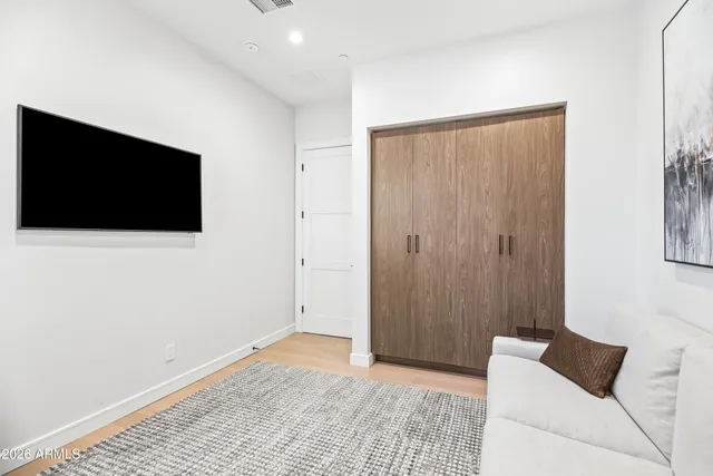 a view of room with a flat screen tv