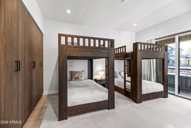 a bedroom with a large bed and a tv