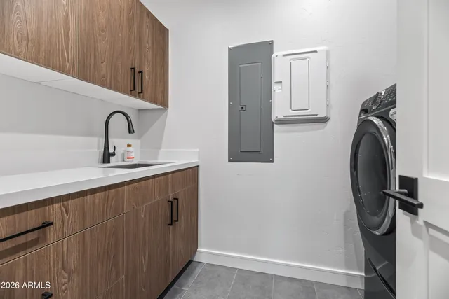 a sink with a washer and dryer