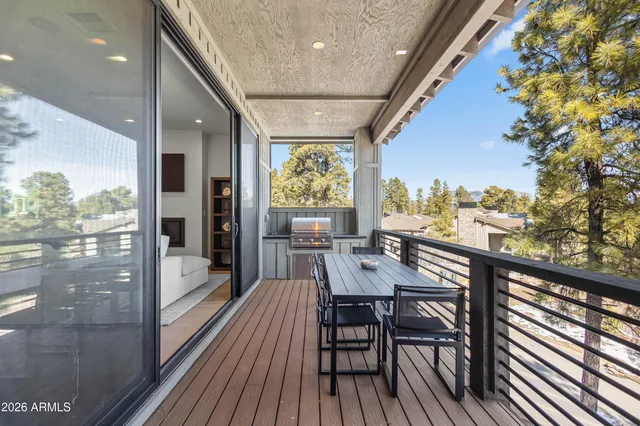 a view of a balcony with chairs