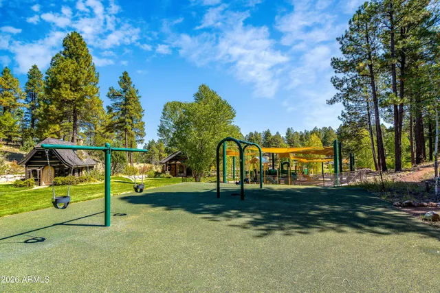 an outdoor space with swimming pool and furniture