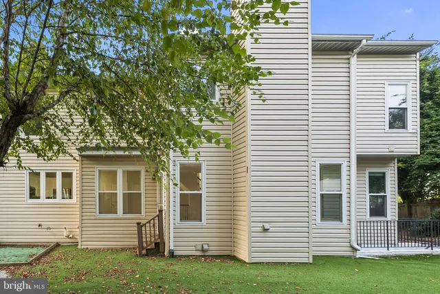 a backyard of a house with seating space