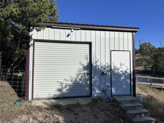 a blue and white vase with flowers in front of it