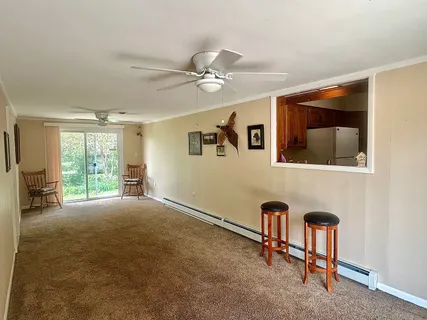 a kitchen with a sink refrigerator and cabinets