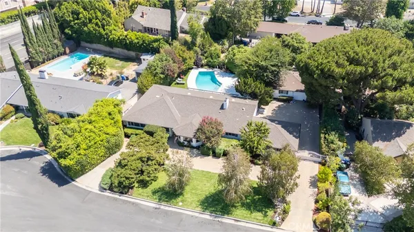 an aerial view of a house with a garden and plants