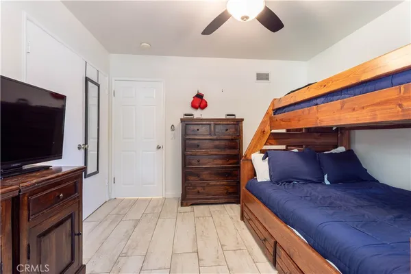 a living room with furniture and flat screen tv