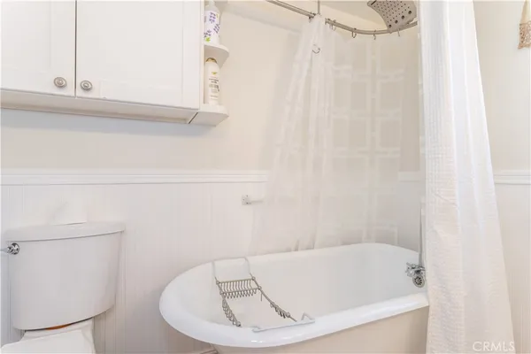 a bathroom with a white bathtub