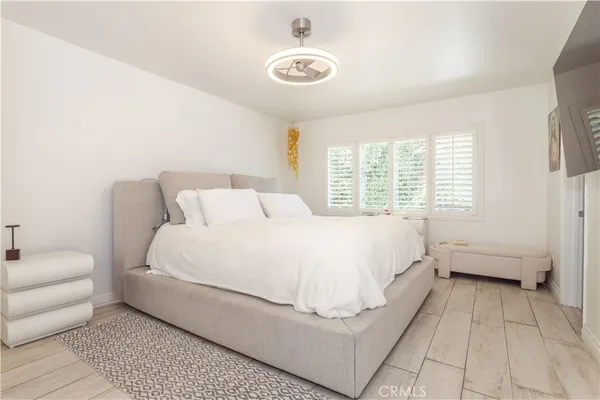 a bed room with a bed and a couch