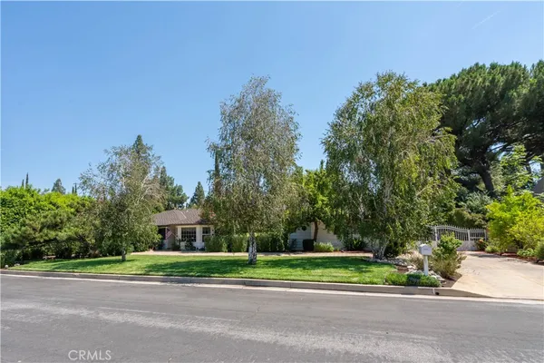 a house view with a garden space