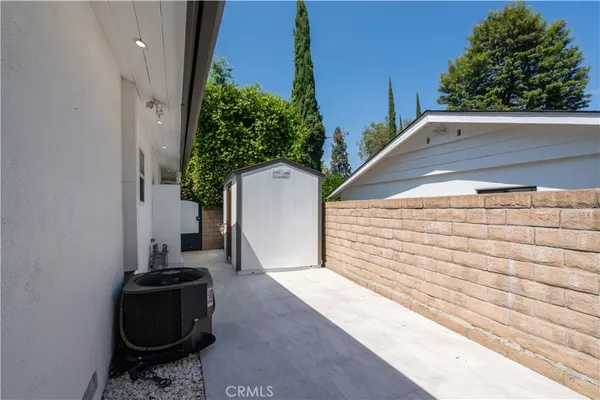 a view of a balcony with chairs