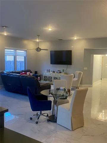 a kitchen with stainless steel appliances granite countertop a refrigerator and a stove