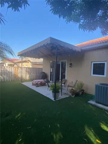 a backyard of a house with lots of green space