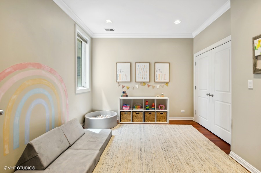 1411 West Chicago Avenue, Unit 3 Chicago, IL 60642 - Photo 15 of 17 a bedroom with a bed and a window