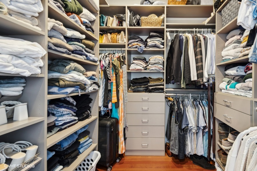 1411 West Chicago Avenue, Unit 3 Chicago, IL 60642 - Photo 16 of 17 a view of walk in closet with clothes and shoes