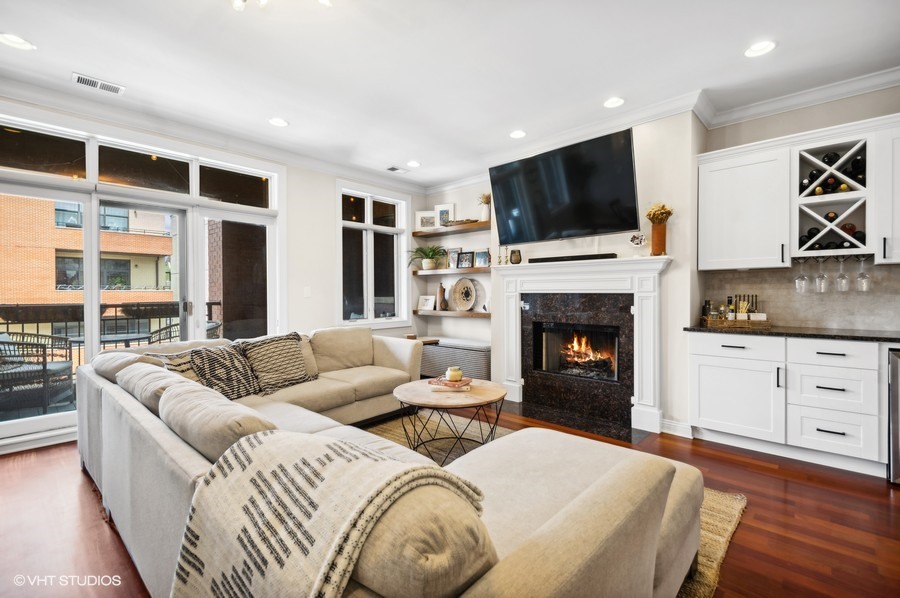 1411 West Chicago Avenue, Unit 3 Chicago, IL 60642 - Photo 2 of 17 a living room with furniture fireplace and flat screen tv