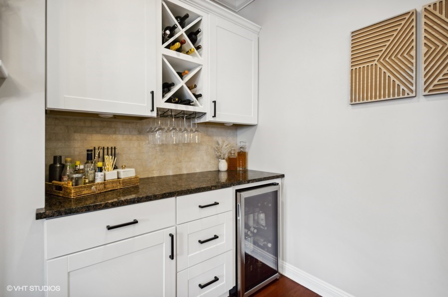 1411 West Chicago Avenue, Unit 3 Chicago, IL 60642 - Photo 4 of 17 a kitchen with granite countertop white cabinets and white appliances