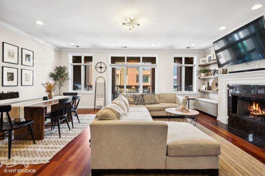 1411 West Chicago Avenue, Unit 3 Chicago, IL 60642 - Photo 5 of 17 a living room with furniture fireplace and flat screen tv