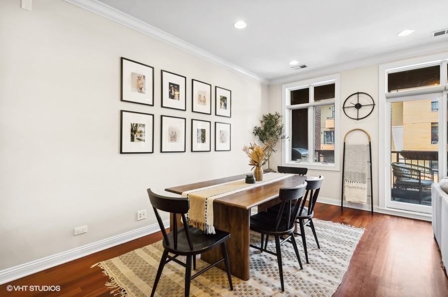 1411 West Chicago Avenue, Unit 3 Chicago, IL 60642 - Photo 7 of 17 a view of a dining room with furniture and wooden floor