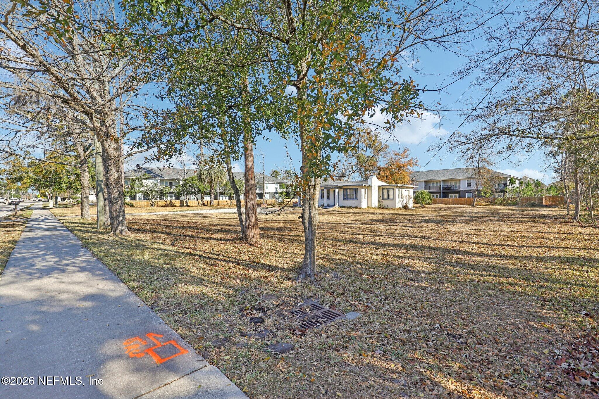10117 Old St Augustine Road Jacksonville, FL 32257 - Photo 4 of 9 a street view with large trees