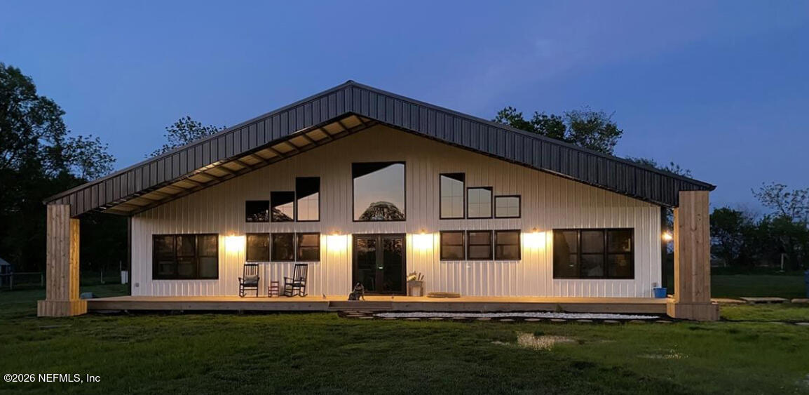10117 Old St Augustine Road Jacksonville, FL 32257 - Photo 9 of 9 a front view of a house with a yard