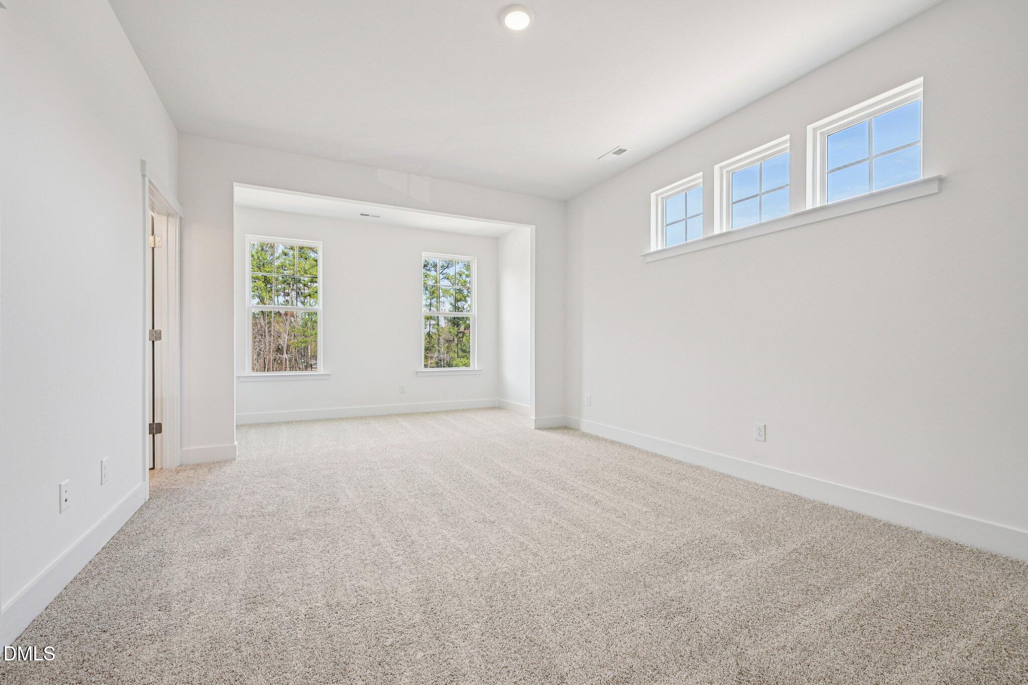 10905 Bayflower Way Raleigh, NC 27617 - Photo 12 of 49 an empty room with windows