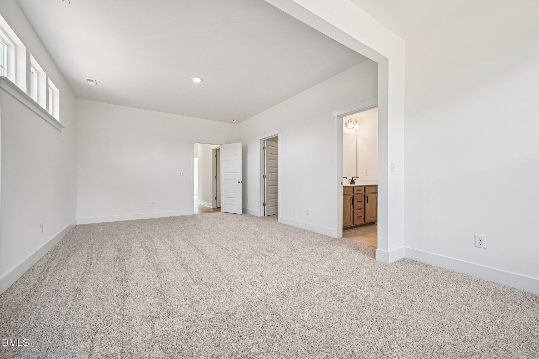10905 Bayflower Way Raleigh, NC 27617 - Photo 13 of 49 an empty room with a natural light