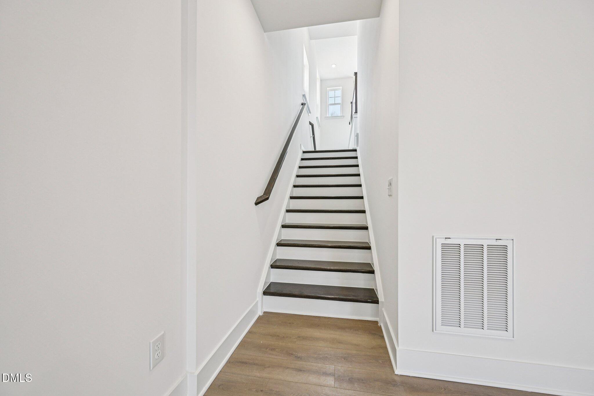 10905 Bayflower Way Raleigh, NC 27617 - Photo 24 of 49 a view of a hallway with stairs