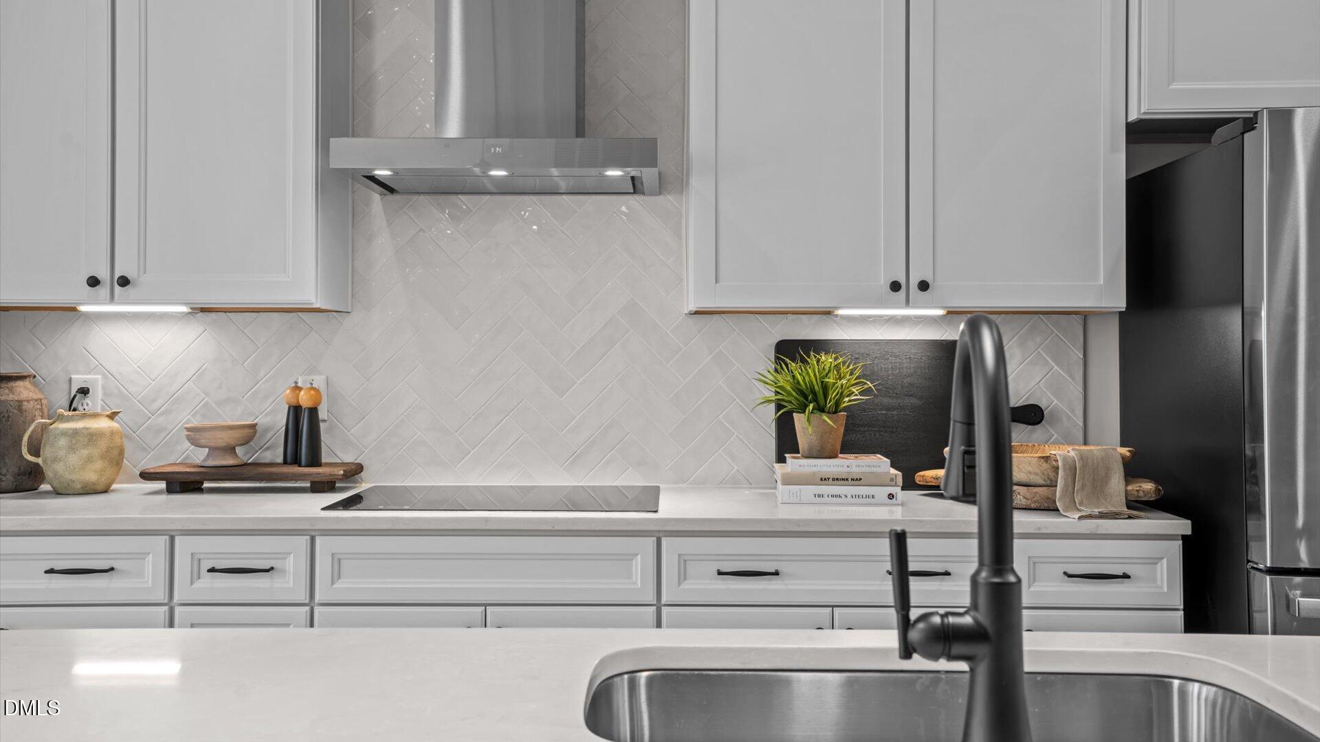 10905 Bayflower Way Raleigh, NC 27617 - Photo 31 of 49 a kitchen with appliances cabinets and a counter top space