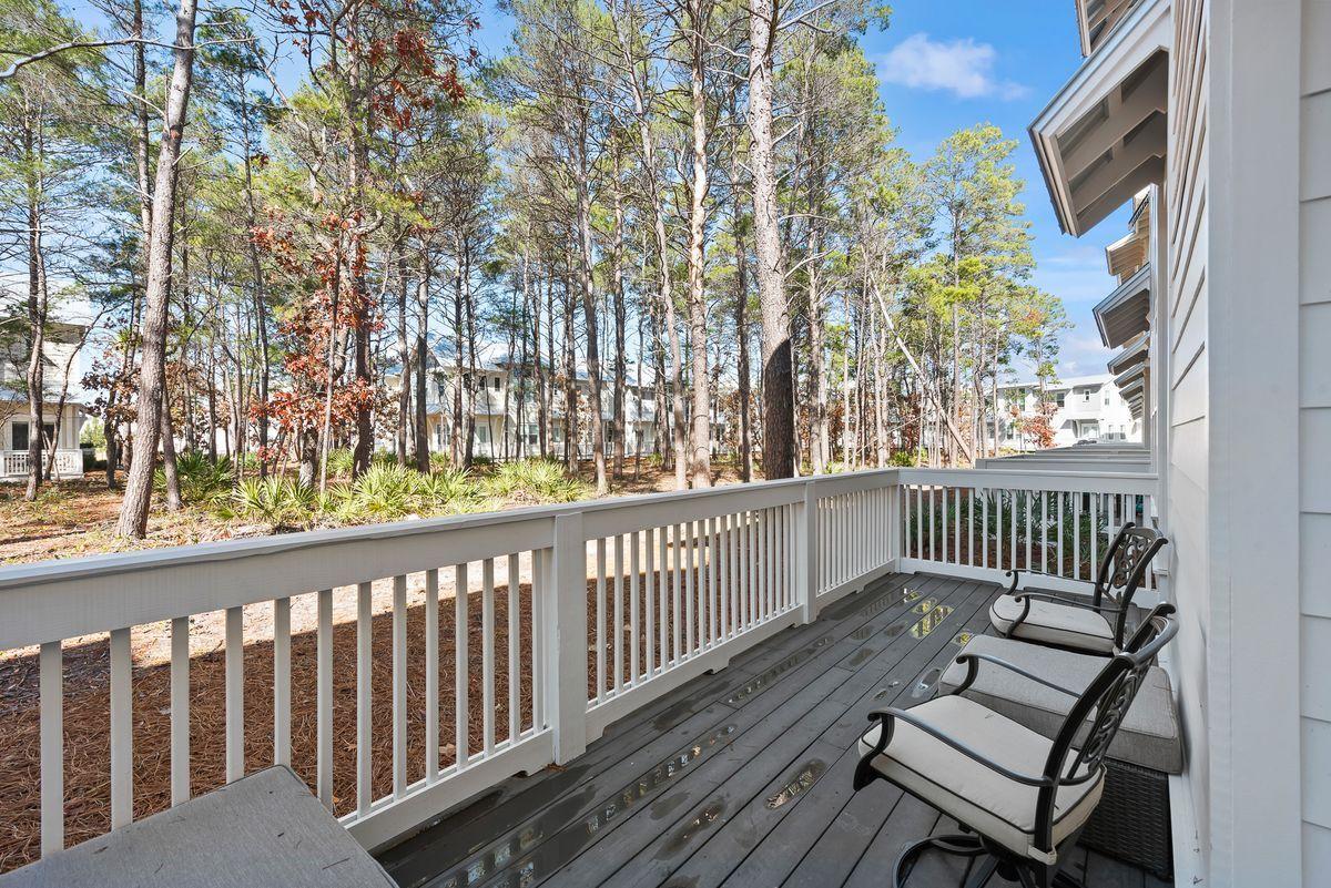 79 Pine Lands Loop Inlet Beach, Unit A Inlet Beach, FL 32461 - Photo 17 of 22 a view of a wooden bench on the roof deck