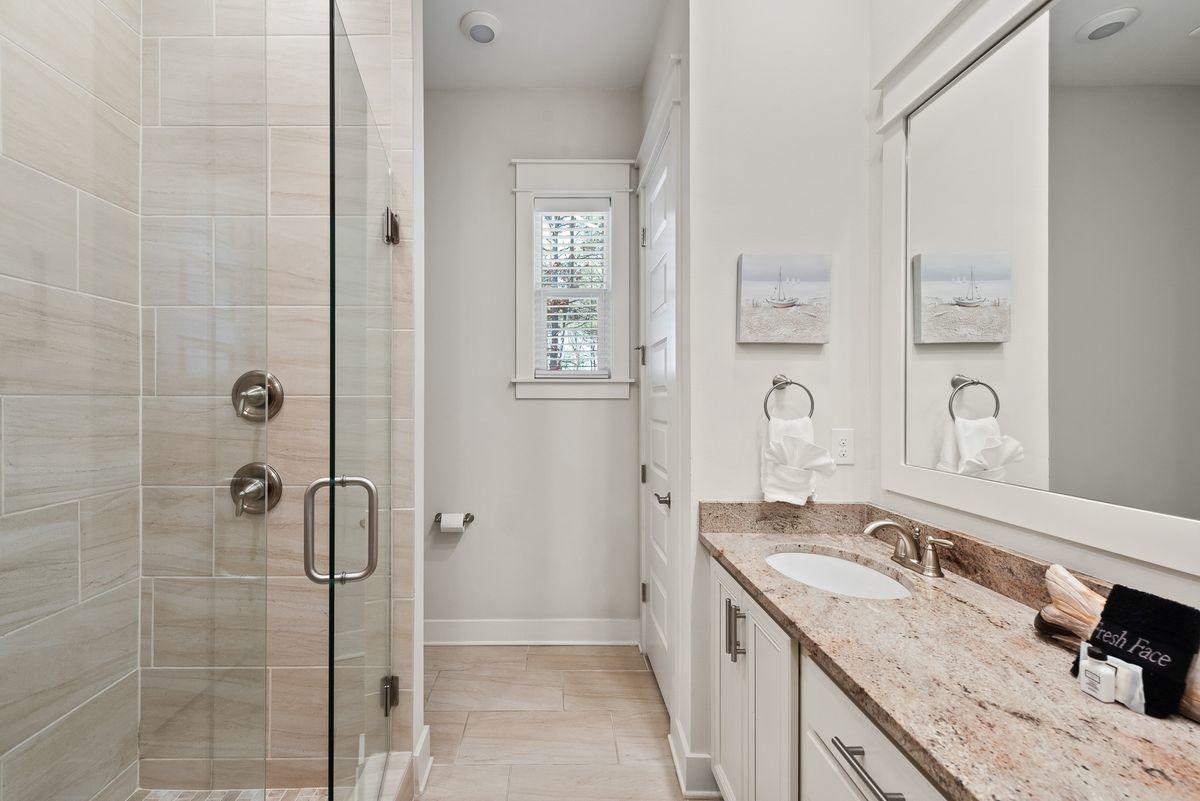 79 Pine Lands Loop Inlet Beach, Unit A Inlet Beach, FL 32461 - Photo 8 of 22 a bathroom with a granite countertop sink mirror and double