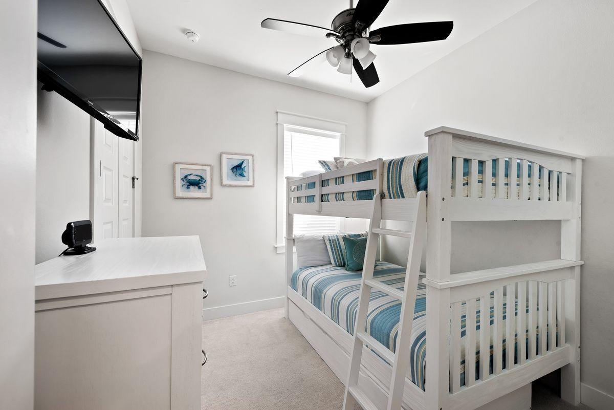 79 Pine Lands Loop Inlet Beach, Unit A Inlet Beach, FL 32461 - Photo 9 of 22 a bedroom with furniture and a window