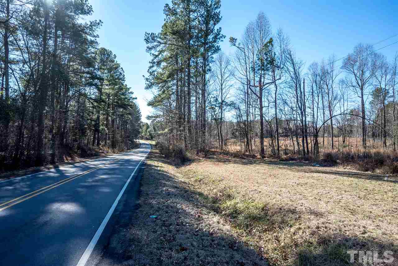 10120 Fanny Brown Road Raleigh, NC 27603 - Photo 3 of 22 a view of a yard with trees