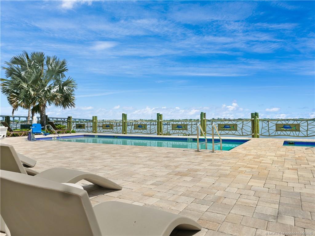 41 Southwest Seminole Street, Unit 208 Stuart, FL 34994 - Photo 35 of 46 a view of a lake with a big yard